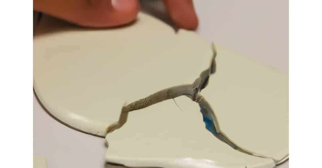 Applying Glue To Ceramic Back Together Step 1