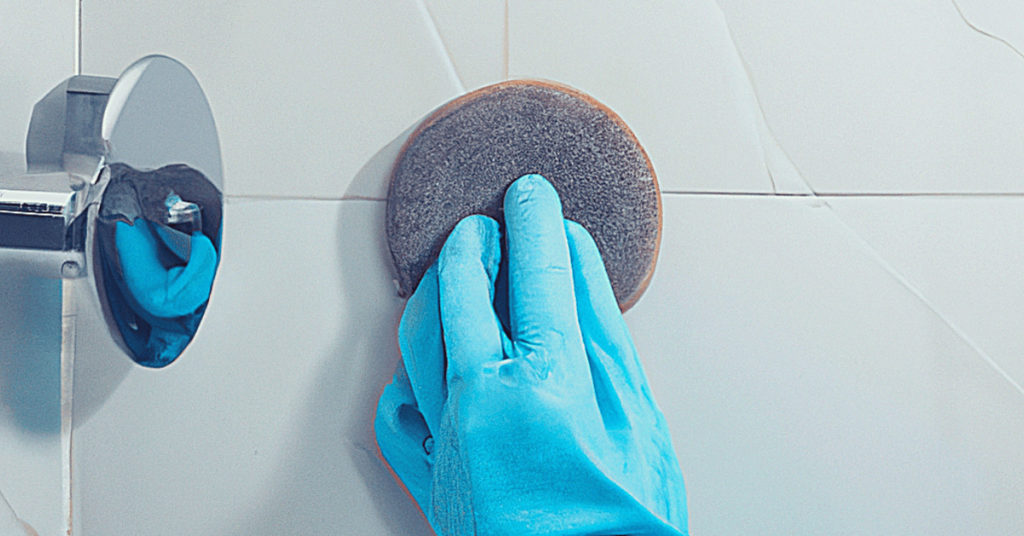 Removing Adhesive from Shower Wall by Abrasive Polishing Pads