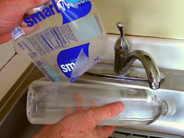 Using Warm Soapy Water To Remove Adhesive From Plastic